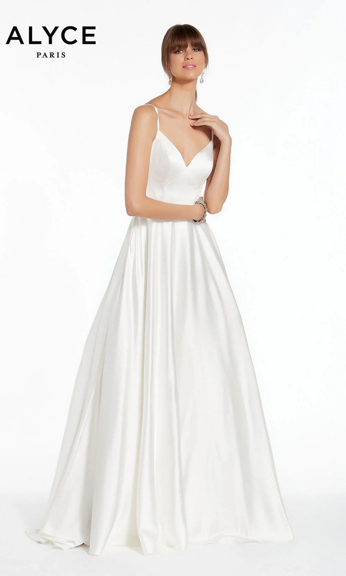 An ivory Alyce 7009 Long White Dress features a sleeveless, V-neck, floor-length satin design with thin straps. A woman models it against a plain white background, with the